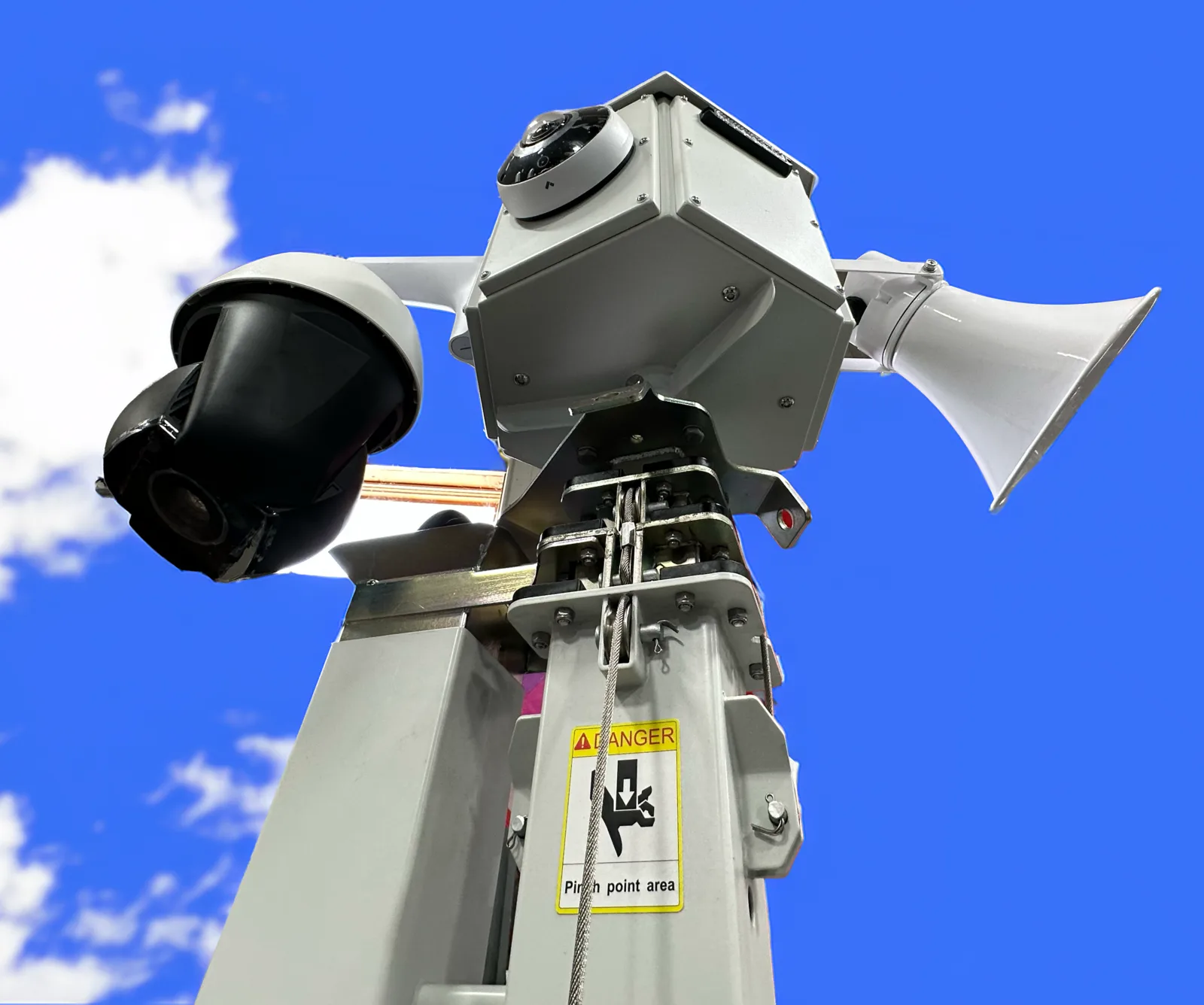 Mast head from below: a PTZ camera, a fisheye camera on the equipment box, and a horn speaker